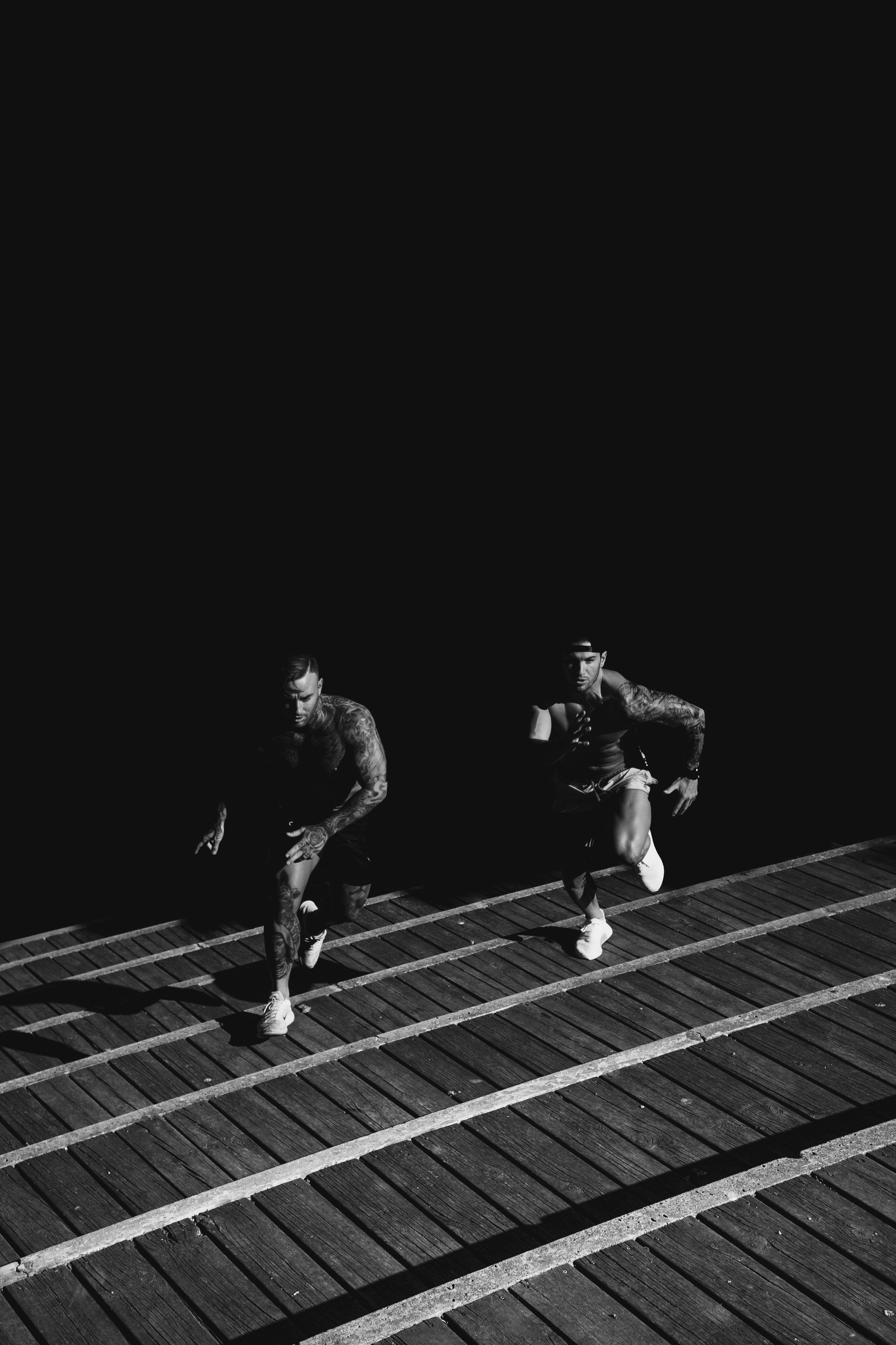 two men running up steps