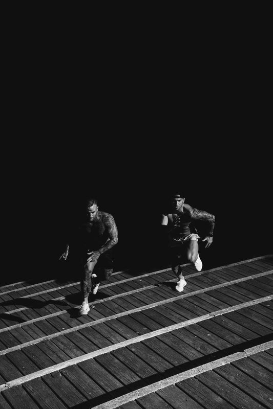 two men running up steps